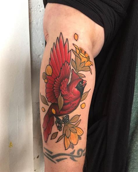 Watercolor cardinal bird tattoo design. Neotraditional cardinal tattoo on the forearm.