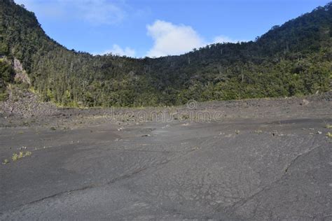 Dormant Volcano Crater Filled In With Rock With Ridge And Rain Forest
