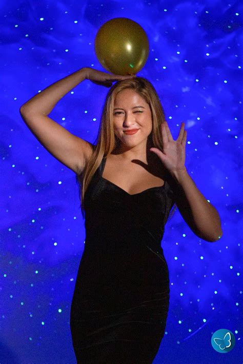 Woman Posing With Balloon In Front Of Galaxy Backdrop New Years Party New Years Eve Galaxy