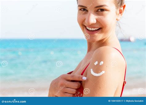 Sun Cream Over Tanned Woman`s Shoulder In The Shape Of Smiling Face Stock Image Image Of