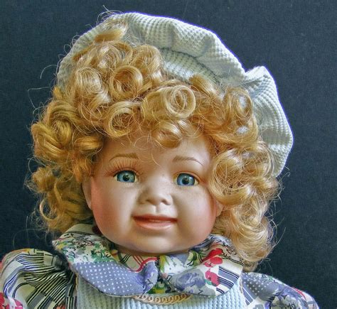 Curly Golden Haired Porcelain Doll Free Stock Photo Freeimages