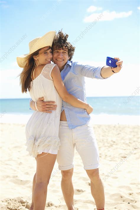 Couple Self Photographing On Beach Stock Image F009 3120 Science Photo Library