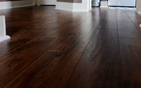 Unlike with hardwood floors, you can't your dark, shiny laminate floor's surface covers a core of particle board, and sanding out the scratch would only remove more of the surface and display. Our New Floors~Goodbye Carpet! | Wood floors wide plank ...