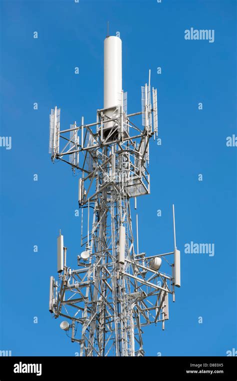 Top Section Of Uhf Tv Transmitter Tower And Mobile Phone Base Station