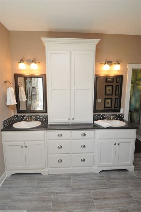 A wall mounted cabinet between the two vanities houses everyday beauty products, toothbrushes, etc. Master bathroom vanity, Bathroom vanities and Linen cabinet on Pinterest