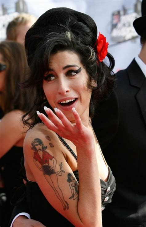 The Beautiful Story Behind The Most Famous Amy Winehouse Tattoo