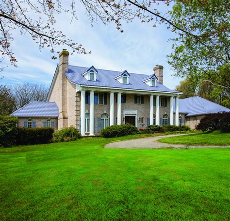 Residential Re-roof: Homeowner Elated with Stamped Metal Shakes in