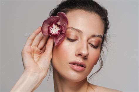 Sensual Half Naked Woman Posing With Orchid On Camera Stock Photo By Vadymvdrobot