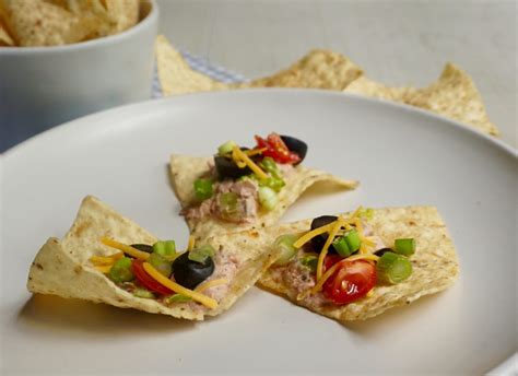 Taco Dip Combines Salsa And Sour Cream And Is Topped With Fresh Veggies