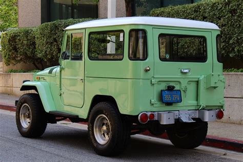 ***super clean with minimal rust ***chevy small black v8engine conversion ***roll cage/ bar ***removable rear passenger jump seats ***custom bumpers ***updated lighting ***original hardtop ***runs strong and very solid, but needs some finishing touches. 1970 Toyota Land Cruiser FJ 40 4WD for sale #87967 | MCG
