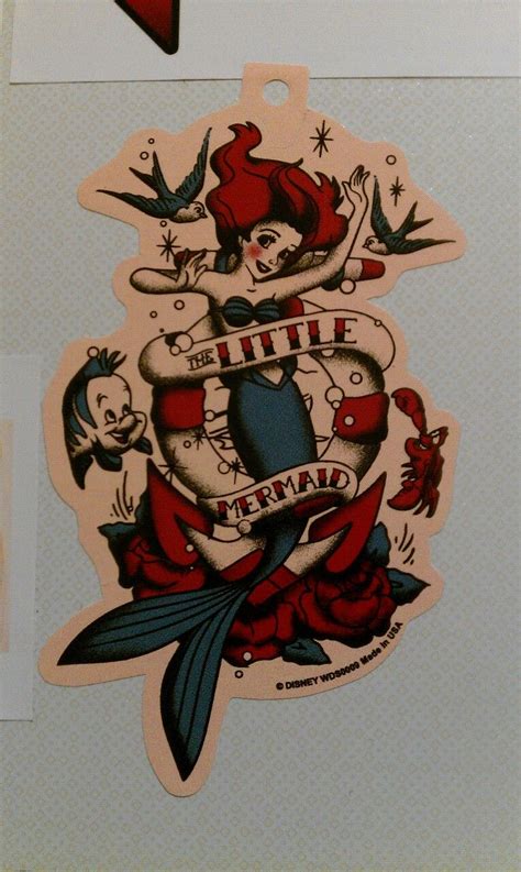 An Old School Tattoo Sticker On The Side Of A Refrigerator