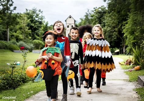 Young Kids Trick Or Treating During Halloween Premium Image By