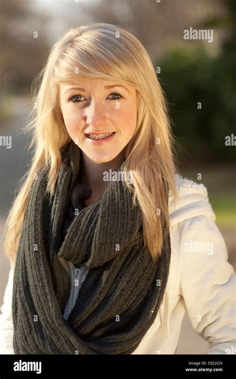 A Slim Blonde 14 Year Old Teenage Girl With Braces On Her