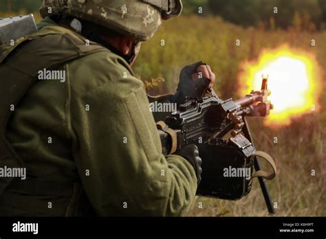 A Ukrainian Soldier Firing Light Machine Gun Stock Photo Alamy