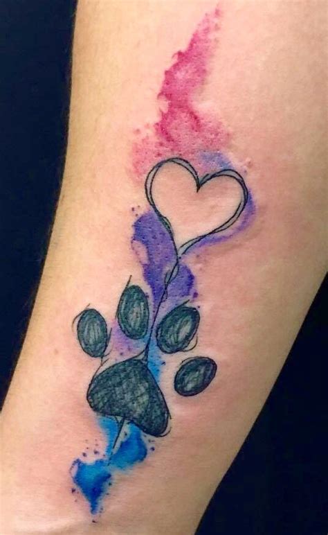 Women choose small feline tracks, and men prefer paws of larger animals. Paw Print Watercolor Tattoo