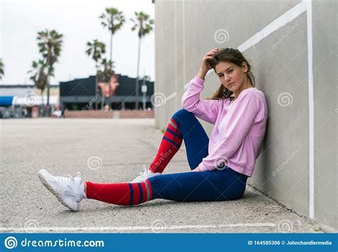 Sporty Woman Back Against Wall Stock Photo Image Of Leaning Brunette