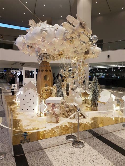 A Display In An Airport Filled With Lots Of Lights And Decorations On