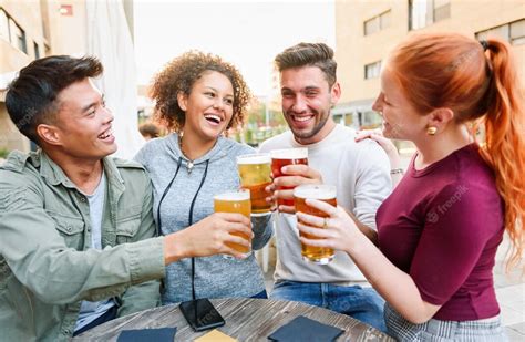 Premium Photo Diverse Cheerful Friends Cheering With Beer