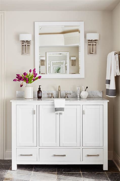 A bathroom vanity backsplash should extend a minimum of 4 inches from the countertop along the width of the vanity. White Vanity With Marble Backsplash Enhances Master ...