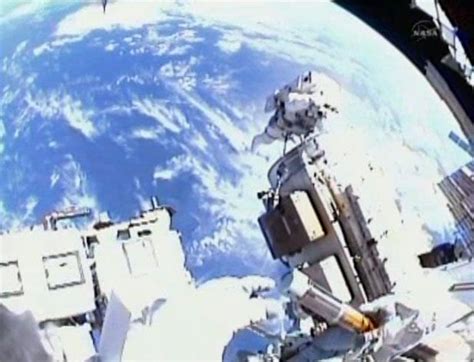 Spacewalking Astronauts Capture Space In A Bottle Space