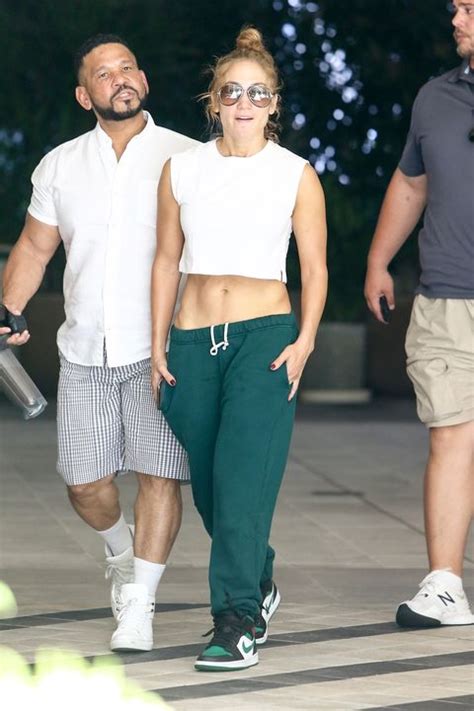 Jennifer Lopez Shows Off Her Abs On In Crop Top And Green Sweatpants