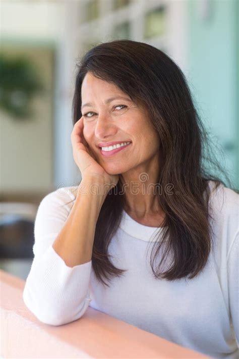 Portrait Of A Beautiful Mature Woman Sitting On The Sofa Stock Image Image Of Adult Females