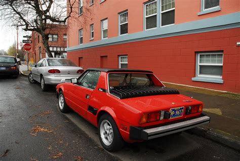 By most admissions, the 1980s were a terrible time to live through: OLD PARKED CARS.: 1980 Fiat X1/9.