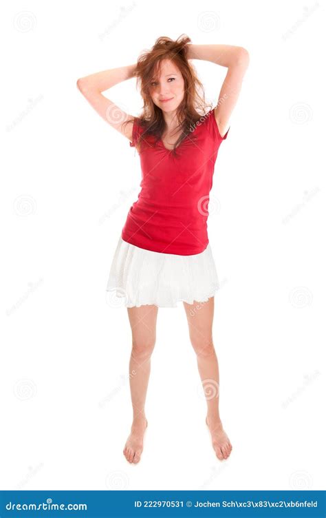 Portrait Of A Smiling Young Woman Wearing A Mini Skirt And A Red Top Stock Image Image Of Cute