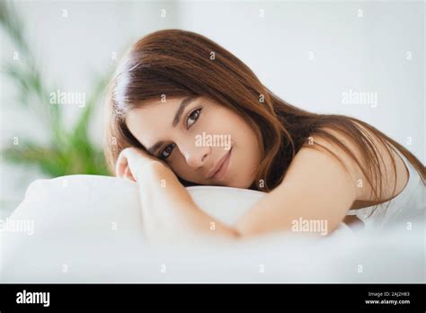 Beautiful Girl Sleeps In The Bedroom Lying On Bed Stock Photo Alamy