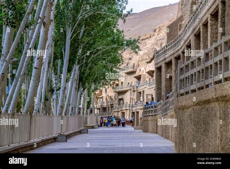 The Tourist Visiting Unesco World Culture Heritage Mogao Caves In