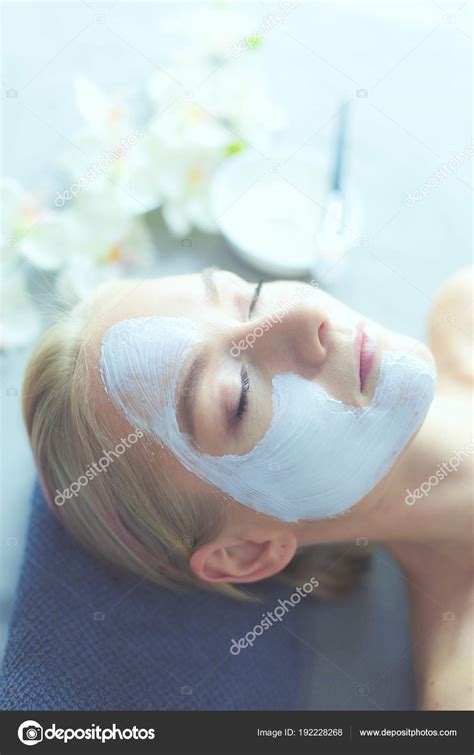 Face Maskbeautiful Young Girl At Spa Cosmetician Woman Applying
