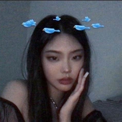 A Woman With Long Black Hair And Blue Butterflies On Her Head Is