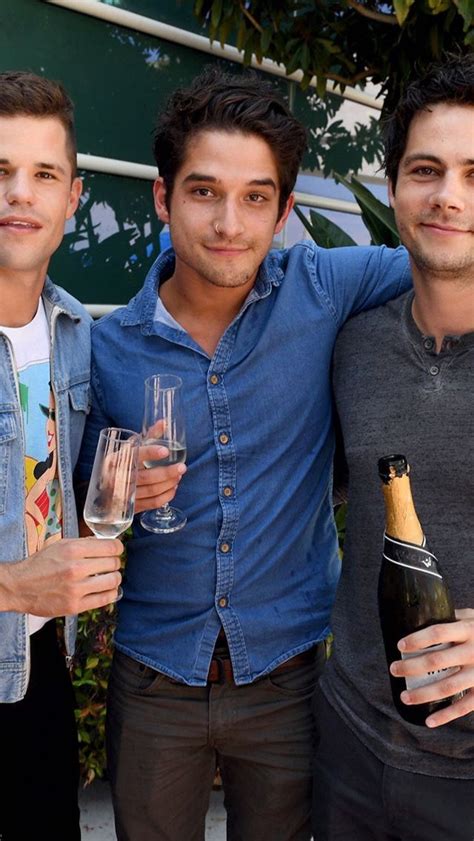 Three Men Standing Next To Each Other Holding Wine Glasses And Champagne Bottles In Their Hands