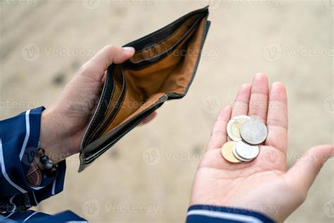 Woman Holds An Empty Purse And Coins In Hand 3131256 Stock Photo At