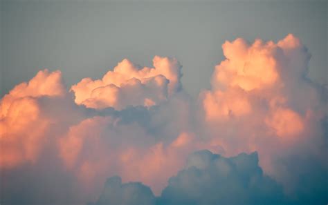 Fluffy Cumulus Clouds In Gray Sky On Sunrise · Free Stock Photo