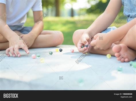 Kids Playing Marbles Image And Photo Free Trial Bigstock