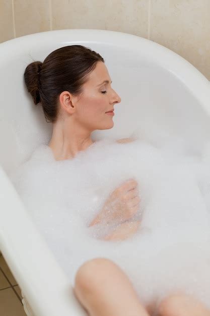 premium photo beautiful woman taking a bath