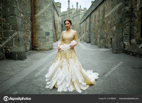 Beautiful Woman Is Wearing Princess Dress With Feathers In The Magic