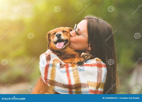 Beautiful Woman Hugging And Kissing Dog Dog And Owner Together