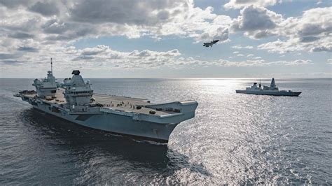 Royal Navys Aircraft Carrier Hms Queen Elizabeth And Her Crews Practice Airborne Missions