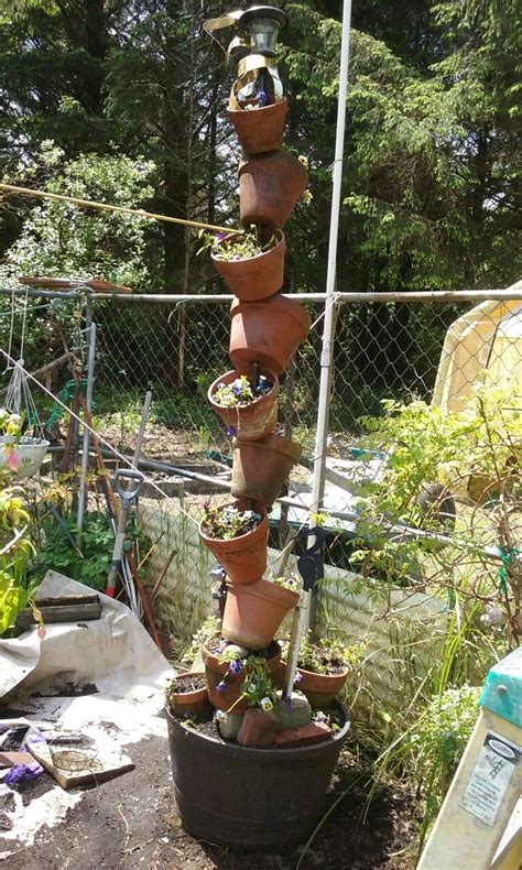 I Stacked Clay Pots Thru An 8 Long 12 Diameter Rebar And Planted