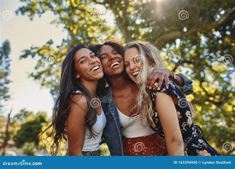 Portrait Of A Happy Multiethnic Group Of Smiling Female Friends Women Laughing And Having Fun