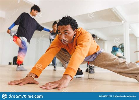 Image Of Biracial Male Hip Hop Dancer Practicing At Dance Studio Stock