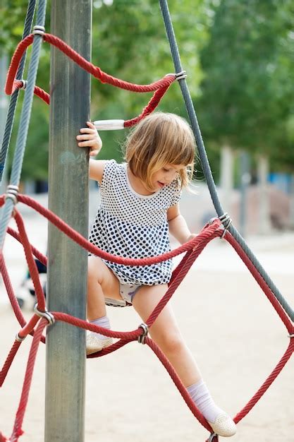 Free Photo Girl In Dress Climbing On Ropes