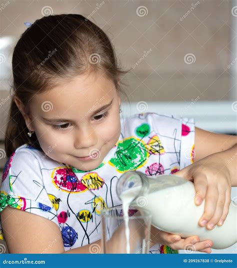 Cute Little Child Girl Is Drinking Milk Stock Photo Image Of Cheerful