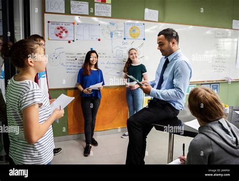 Group Of Students Presentation In Classroom Stock Photo Alamy