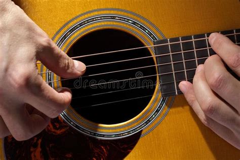 Guitarist Acoustic Guitarist Playing Guitar Close Up On Fretboard And
