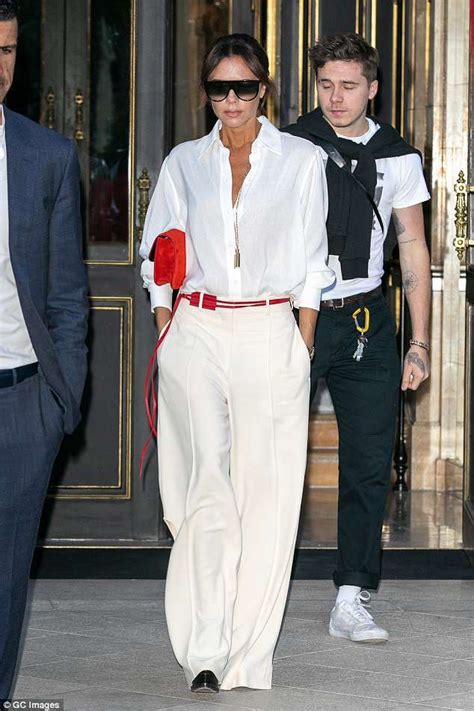 Victoria Beckham Looks Chic In A White Blouse As She And Son Brooklyn