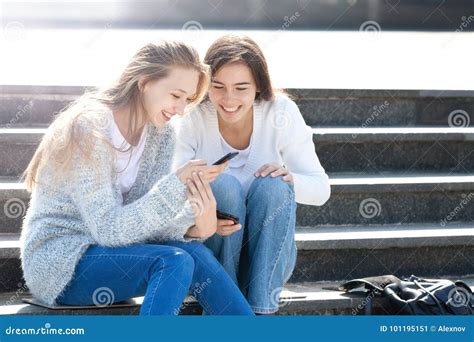 Two Girls Talking Together In The Street Stock Image Image Of