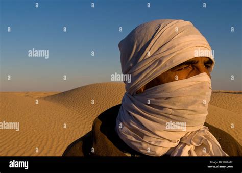 Graphic Portrait Of Bedouin Man In Sahara Desert With Sand In Douz